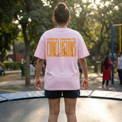 Jumping To Conclusions oversized graphic tee worn in an Indian street-style setting — Light Baby Pink streetwear India | StyleUp.Today