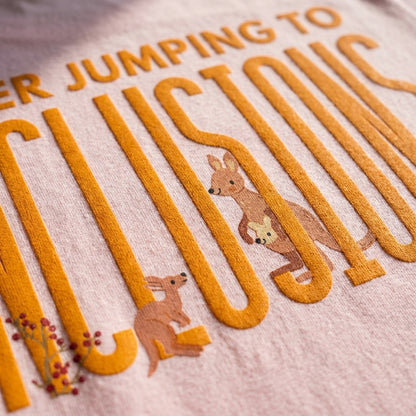 Jumping To Conclusions oversized graphic tee worn in an Indian street-style setting — Light Baby Pink streetwear India | StyleUp.Today